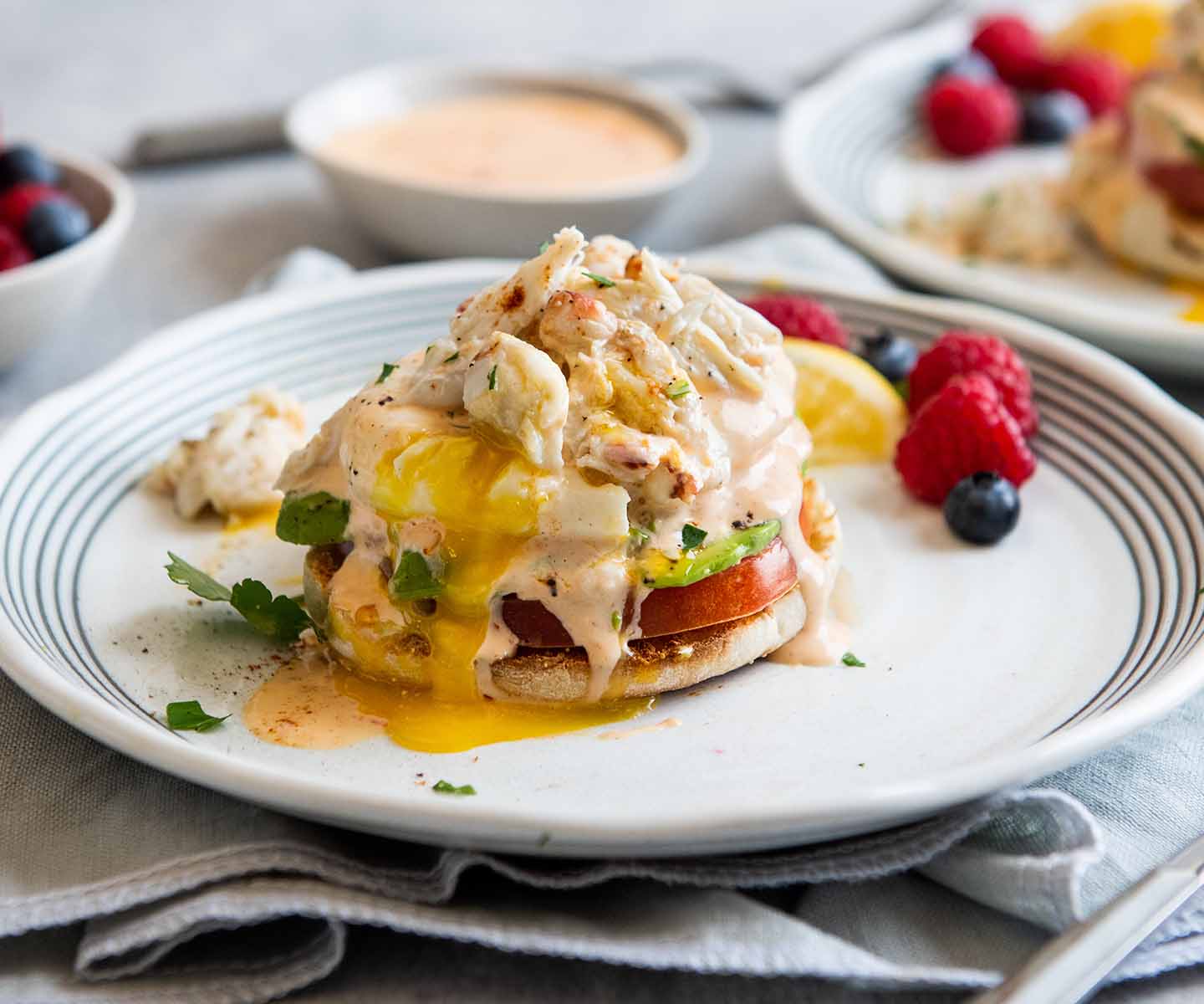 Eggs Benedict with spicy chicken and avocado